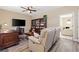Comfortable living room features a TV, desk, and sitting area at 4212 Hawks Glide Ave, North Las Vegas, NV 89084