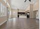 Open living space with tall ceilings and kitchen area, filled with natural light from large windows at 4212 Hawks Glide Ave, North Las Vegas, NV 89084