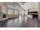Bright open-concept living space with tall ceilings, fireplace, bar seating, and outdoor access at 4212 Hawks Glide Ave, North Las Vegas, NV 89084