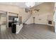 Spacious open-concept living area with tall ceilings, a fireplace, and a kitchen area at 4212 Hawks Glide Ave, North Las Vegas, NV 89084