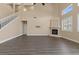 Bright living room features a fireplace, large windows with shutters, and soaring ceilings at 4212 Hawks Glide Ave, North Las Vegas, NV 89084