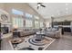 Spacious living room features a fireplace, large windows, and an open floor plan at 4212 Hawks Glide Ave, North Las Vegas, NV 89084