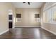 Spacious living room with wood-look floors, neutral paint, and plantation shutters at 4212 Hawks Glide Ave, North Las Vegas, NV 89084