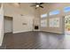 Spacious living room featuring a fireplace, tall ceilings, and large windows for plenty of sunlight at 4212 Hawks Glide Ave, North Las Vegas, NV 89084