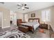 Comfortable main bedroom features plantation shutters and wood-look flooring at 4212 Hawks Glide Ave, North Las Vegas, NV 89084