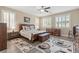 Comfortable main bedroom with plantation shutters and elegant furniture at 4212 Hawks Glide Ave, North Las Vegas, NV 89084