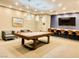 Inviting game room features a stylish pool table, modern lighting, comfortable seating, and a bar at 4525 Dean Martin Dr # 1103, Las Vegas, NV 89103