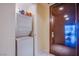 Convenient laundry area with stacked washer and dryer and storage space at 4525 Dean Martin Dr # 1103, Las Vegas, NV 89103