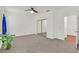 Spacious bedroom with carpet flooring and a mirrored closet, creating a bright and open space at 731 Rising Star Dr, Henderson, NV 89014