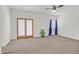 Large bedroom with natural light, carpet, and doors to an outside patio area at 731 Rising Star Dr, Henderson, NV 89014