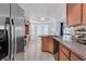 Bright kitchen with an island counter, stainless appliances, and wood cabinets at 731 Rising Star Dr, Henderson, NV 89014