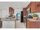 Efficient kitchen design featuring wood cabinets, stainless steel appliances and tile floors at 731 Rising Star Dr, Henderson, NV 89014