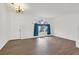 Bright living room features new wood floors and an elegant light fixture at 731 Rising Star Dr, Henderson, NV 89014