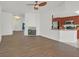 Open-concept living room with wood floors and access to the adjacent kitchen at 731 Rising Star Dr, Henderson, NV 89014