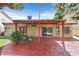 Inviting covered patio with ample space for seating and a porch swing at 731 Rising Star Dr, Henderson, NV 89014