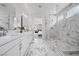 Contemporary bathroom with a glass shower, dual sinks, and a view into another room at 8440 Footpath St, Las Vegas, NV 89166