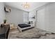 Cozy bedroom with a modern bed, stylish decor, and ample closet space at 8440 Footpath St, Las Vegas, NV 89166