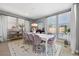 Elegant dining room with large windows and stylish decor at 8440 Footpath St, Las Vegas, NV 89166