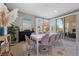 Dining area featuring a modern table, comfortable seating, and natural light at 8440 Footpath St, Las Vegas, NV 89166
