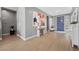 Inviting entryway with modern decor, light hardwood floors, and stylish accents at 8440 Footpath St, Las Vegas, NV 89166