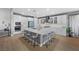 Spacious kitchen with an island, pendant lights, and stainless steel appliances at 8440 Footpath St, Las Vegas, NV 89166
