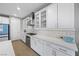 Modern white kitchen features stainless steel appliances, sleek countertops, and ample cabinet space at 8440 Footpath St, Las Vegas, NV 89166