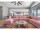 Open living area with comfortable seating and view of the modern kitchen at 8440 Footpath St, Las Vegas, NV 89166