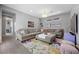 Cozy living room with comfortable seating, stylish decor, and ample natural light at 8440 Footpath St, Las Vegas, NV 89166