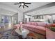 Sun-filled open living room, showcasing the stylish decor and design, and seamless flow with the kitchen at 8440 Footpath St, Las Vegas, NV 89166