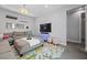 Relaxing living room with comfortable furniture, stylish accents, and a modern TV at 8440 Footpath St, Las Vegas, NV 89166
