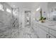 Modern bathroom featuring a glass-enclosed shower and double vanity with ample counter space at 8440 Footpath St, Las Vegas, NV 89166