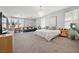 Spacious main bedroom featuring a sitting area and abundant natural light at 8440 Footpath St, Las Vegas, NV 89166
