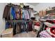 Spacious walk-in closet with shelving and ample hanging space for organized storage at 8440 Footpath St, Las Vegas, NV 89166