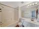 Bathroom with a combined shower and tub, a large mirror, and modern fixtures at 10809 Garden Mist Dr Dr # 2041, Las Vegas, NV 89135