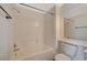 Bright bathroom with tiled shower and tub, modern fixtures, large mirror, and white vanity at 10809 Garden Mist Dr Dr # 2041, Las Vegas, NV 89135