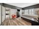 Spacious bedroom with wood floors, shutters, wainscoting and a view to the hallway at 10809 Garden Mist Dr Dr # 2041, Las Vegas, NV 89135