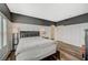 Stylish bedroom features wood floors, modern wainscoting, and a large bed at 10809 Garden Mist Dr Dr # 2041, Las Vegas, NV 89135