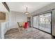 Dining room featuring a round table, stylish chairs, and sliding glass doors to a balcony at 10809 Garden Mist Dr Dr # 2041, Las Vegas, NV 89135