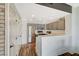 Bright kitchen with gray cabinets, stainless steel appliances, white tile countertops, and wood floors at 10809 Garden Mist Dr Dr # 2041, Las Vegas, NV 89135