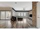 Spacious living room features stylish brick accent wall, wood floors, and sliding glass doors at 10809 Garden Mist Dr Dr # 2041, Las Vegas, NV 89135