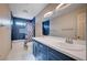 Stylish bathroom featuring a dual sink vanity, blue tile accents, and shower-tub combination at 1580 Albino Dr, Henderson, NV 89002