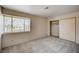 Comfortable bedroom featuring a large window and closet at 1580 Albino Dr, Henderson, NV 89002