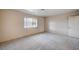 Clean bedroom with carpet, a window and closet door at 1580 Albino Dr, Henderson, NV 89002