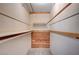 Walk-in closet with multiple shelves and rods for optimal storage at 1580 Albino Dr, Henderson, NV 89002