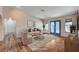 Inviting living room with a cozy seating arrangement, bright doors and neutral decor for a comfortable atmosphere at 1580 Albino Dr, Henderson, NV 89002