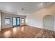 Expansive living room with hardwood floors and ample natural light, creating a warm and inviting atmosphere at 1580 Albino Dr, Henderson, NV 89002