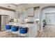 Modern kitchen featuring a large island, marble counters, and stainless steel appliances at 2714 Langlade Ave, Henderson, NV 89052
