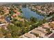 Stunning aerial view of lake community featuring lush greenery and beautiful homes at 3024 Pismo Beach Dr, Las Vegas, NV 89128