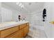 Bathroom featuring tile counters, glass shower, and dual sink vanity at 3024 Pismo Beach Dr, Las Vegas, NV 89128
