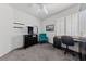 Well-lit bedroom with black dresser, workspace, and comfortable blue chair at 3024 Pismo Beach Dr, Las Vegas, NV 89128
